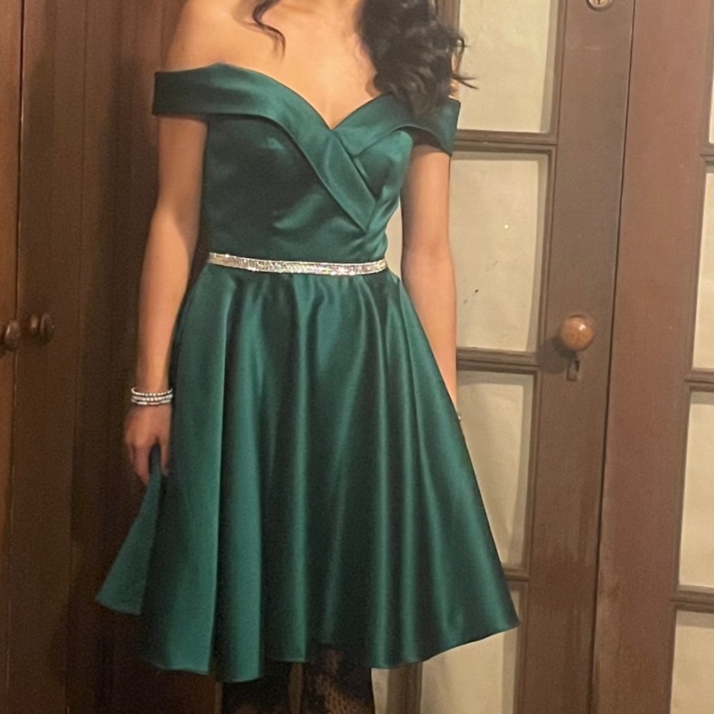 Green off the shoulder dress with a rhinestone belt. U.S 4